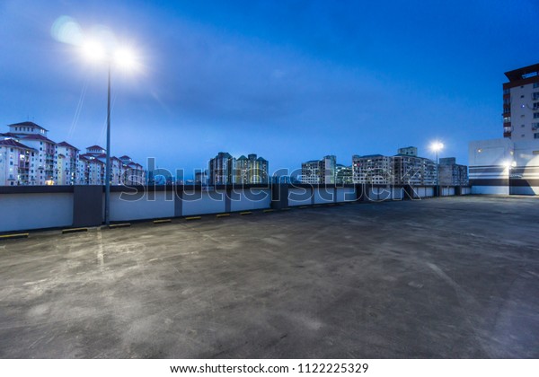 Beautiful rooftop empty\
car park at dawn