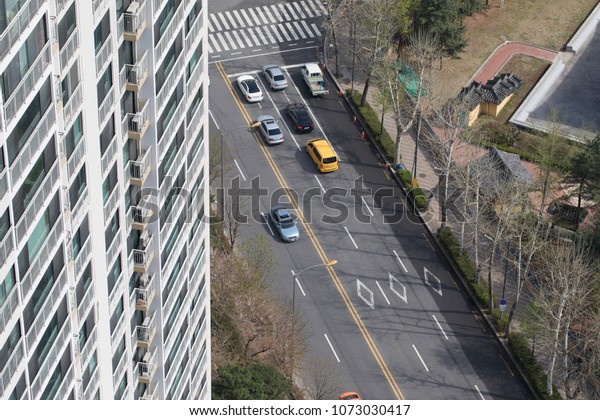 Car on the road from the\
rooftop.