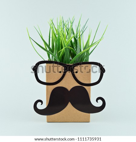 Funny face on paper bag with glasses and mustache