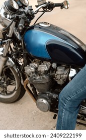 close up view of vintage blue motorcycle and chrome engine