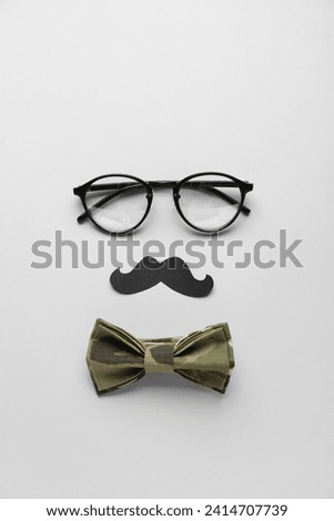 Similar – Funny face on paper bag with glasses and mustache