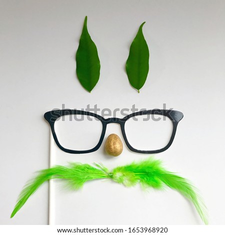 Similar – Funny face on paper bag with glasses and mustache