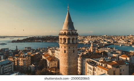 Galata tower. Close-up photo of Galata Tower, one of the few beauties of Istanbul, taken with a drone at sunrise. Magnificent view of the sea and buildings in the background.