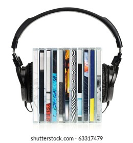 HI-Fi headphones on stack of CDs on white background