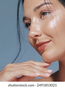 High-quality close-up of an Asian woman with glowing skin and natural makeup, posing elegantly with her hand under her chin. Perfect for beauty, skincare, and cosmetic advertisements, emphasizing