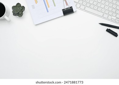 Office desk with financial reports, keyboard and cup of coffee. Top view with copy space