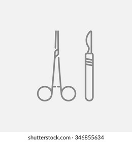 Medical scalpel and clamp for web, mobile and infographics. Vector dark grey icon isolated on light grey background.