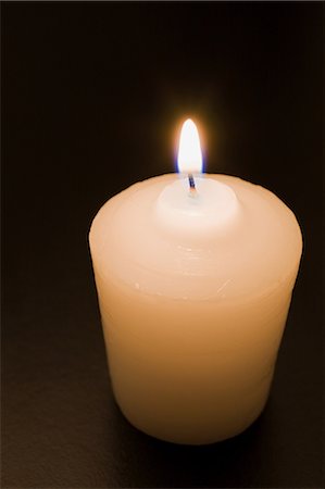 Candle black background Stock Photos - Page 1 : Masterfile