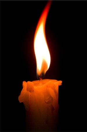 Candle black background Stock Photos - Page 1 : Masterfile