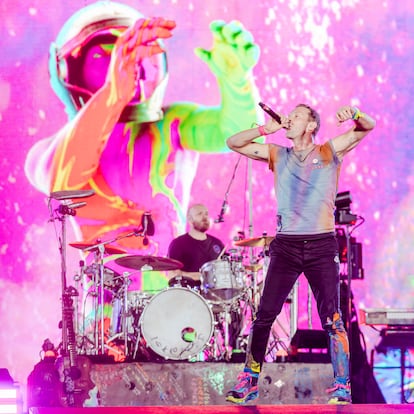 Coldplay during a concert in Glasgow on August 23. In the foreground Chris Martin and, in the background, drummer Will Champion.