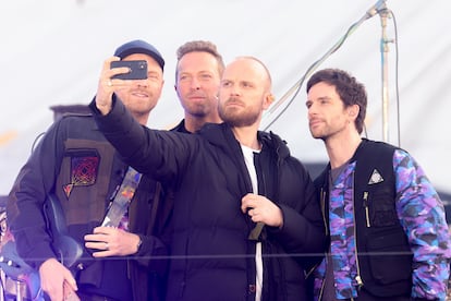 From left to right, Jonny Buckland (guitar), Chris Martin (vocals), Will Champion (drums) and Guy Berryman (bass), in London, in May 2021, at the Brit Awards.