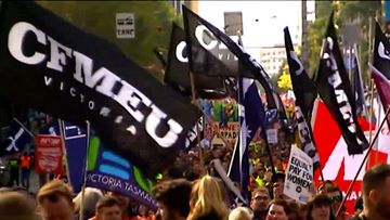 CFMEU union members marching at a rally in Melbourne.