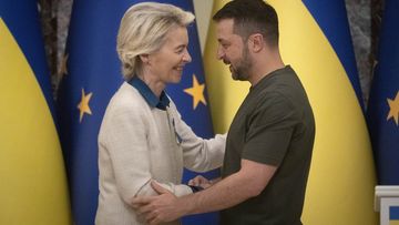 Ukrainian President Volodymyr Zelenskyy, right, and European Commission President Ursula von der Leyen