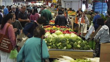 General photo of people shopping for fruits and vegetables at the Queen Vic Market on Friday 2, December 2023. inflation consumer economy