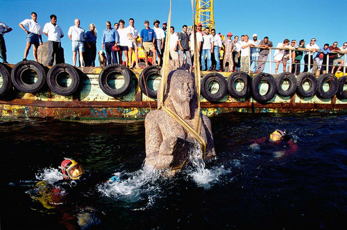 Franck Goddio and his team watch the rise to the surface of a colossal statue of red granite Picture: Franck Goddio/Hilti Foundation/ Christoph Gerigk