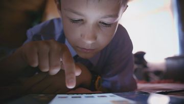 A child using a tablet.