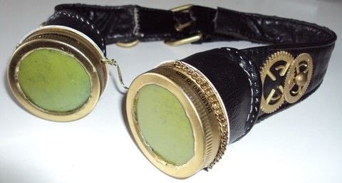 Cheap but effective Steampunk Goggles .  Make a pair of goggles in under 180 minutes using acrylic paint, chain, and needle & thread. Inspired by halloween, gothic, and steampunk. Creation posted by Juliet J. Difficulty: 3/5. Cost: Cheap.