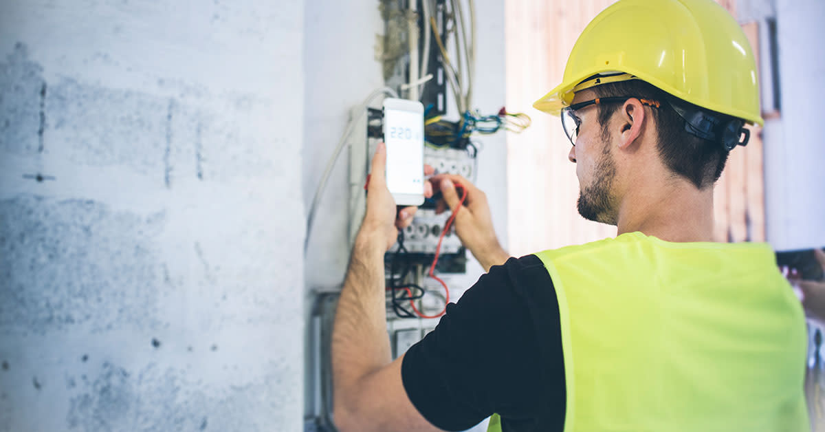 Construction worker setting up the electrical box