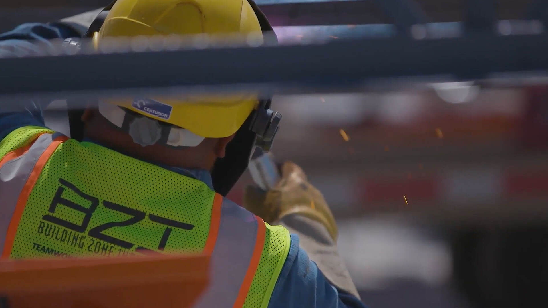 a BZI construction worker using a welder