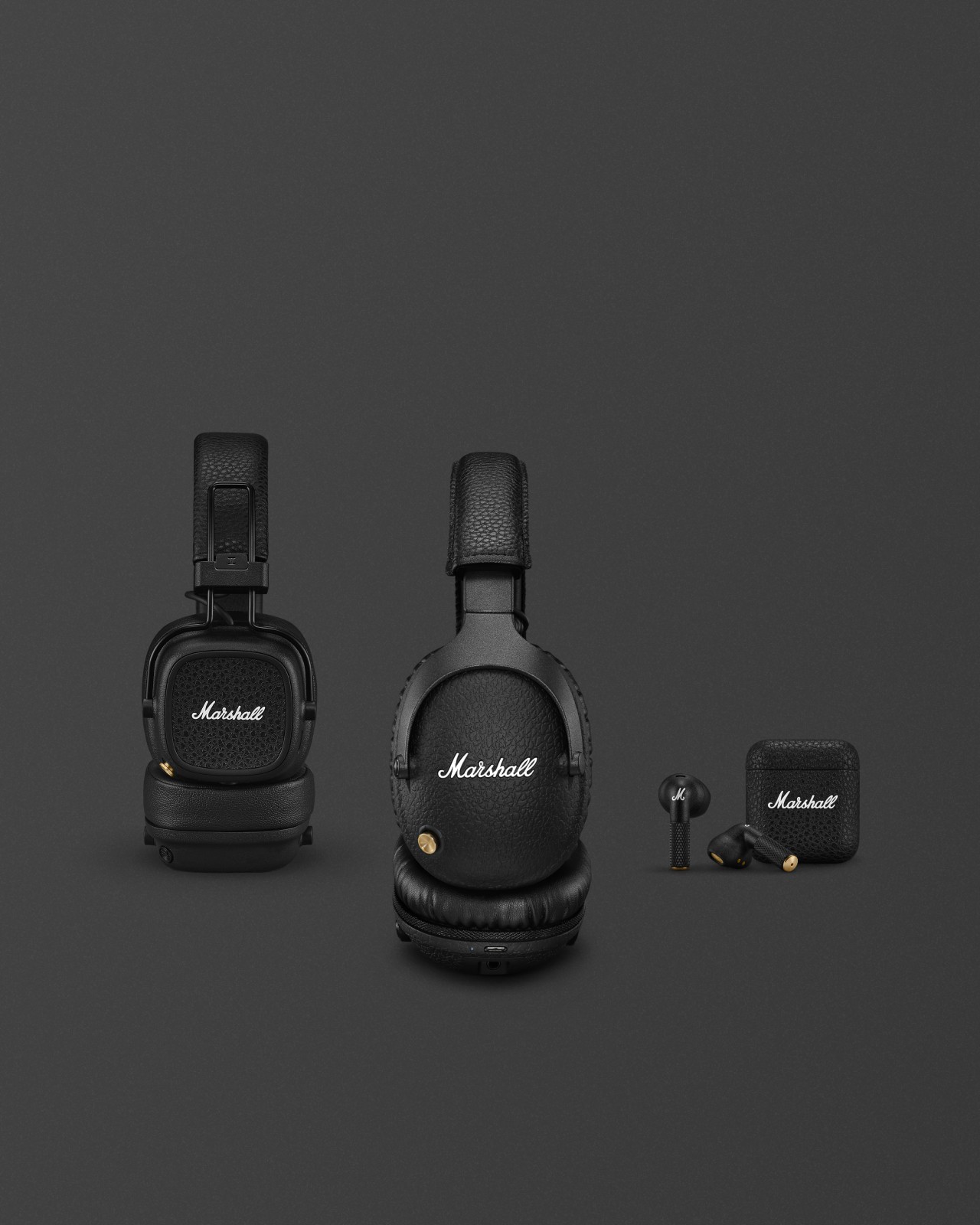 A pair of black headphones from Marshall on a gray background.