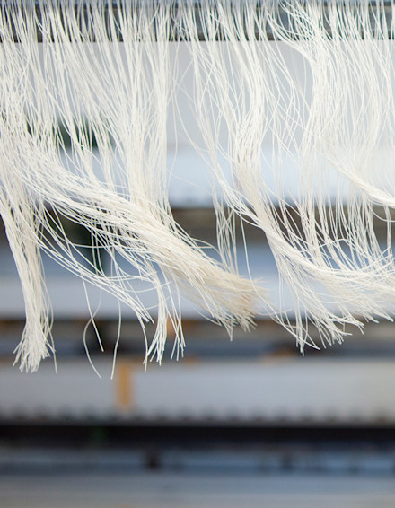 Close up photograph of fabric threads