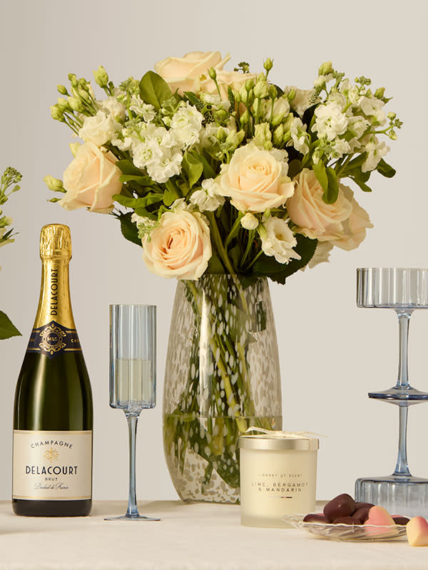 Flowers with wine . Shop Anniversary gifts