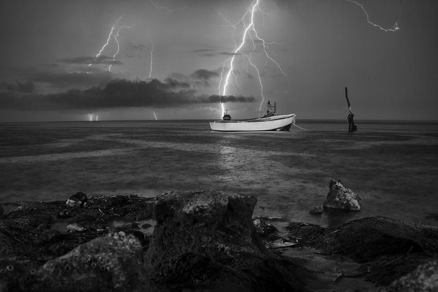 Fishing in the Storm Photograph by Gustavo Alonso - Fine Art America