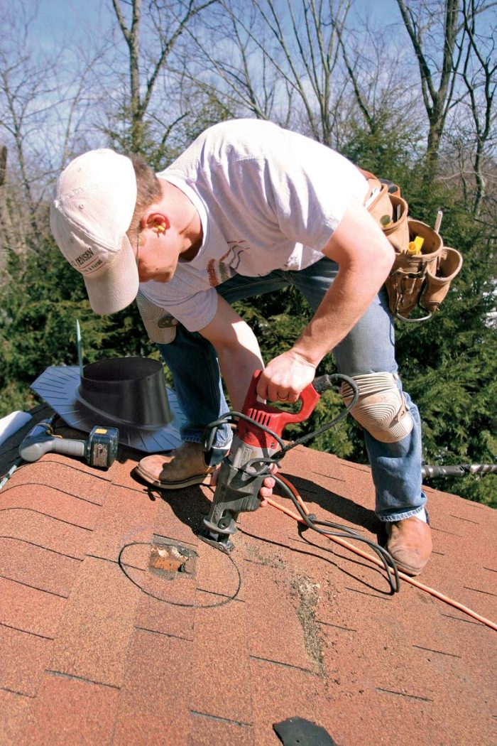 Start by using the flashing as a template, and trace around the inside with chalk. Cut the hole to the outside of the line. A rough cut is fine because the flashing has a big footprint.