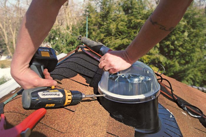 After the flashing and tube are in place, attach the dome, and get off the roof.