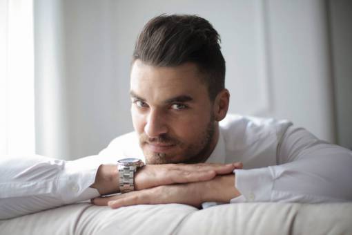 business Portrait of a businessman with white shirt staring at camera at home