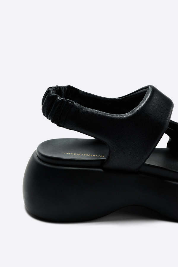 "INTENTIONALLY __________." TEATIME PLATFORM SANDAL