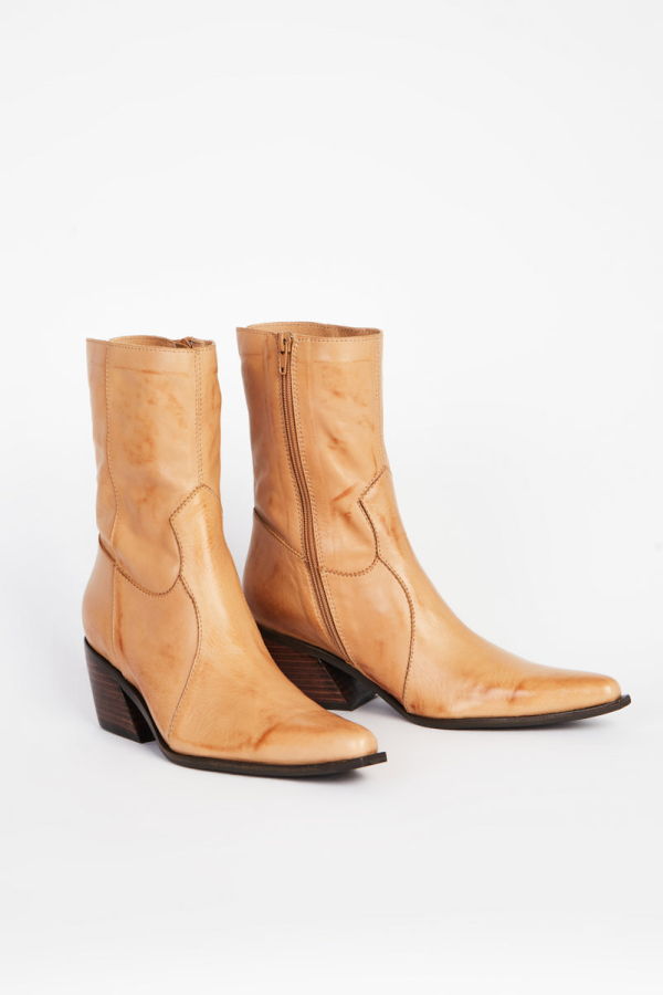 "INTENTIONALLY __________." Mattie Heeled Boot