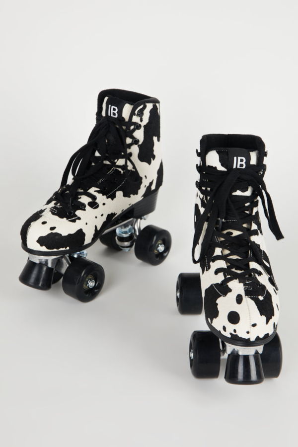 "INTENTIONALLY __________."  Whip It Roller Skate - Black Moo