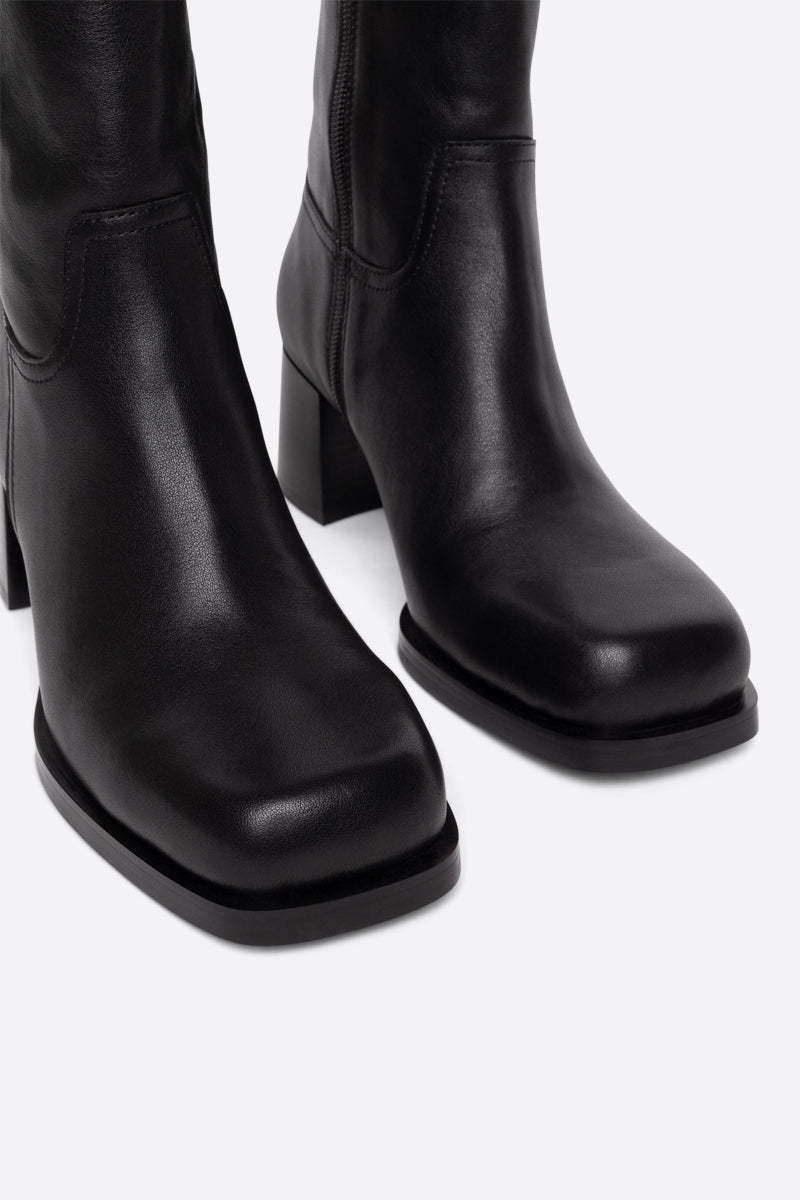 "INTENTIONALLY __________." VICO HEELED BOOT