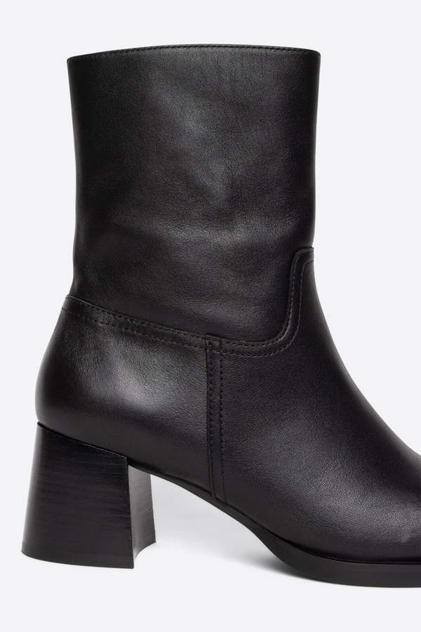 "INTENTIONALLY __________." VICO HEELED BOOT