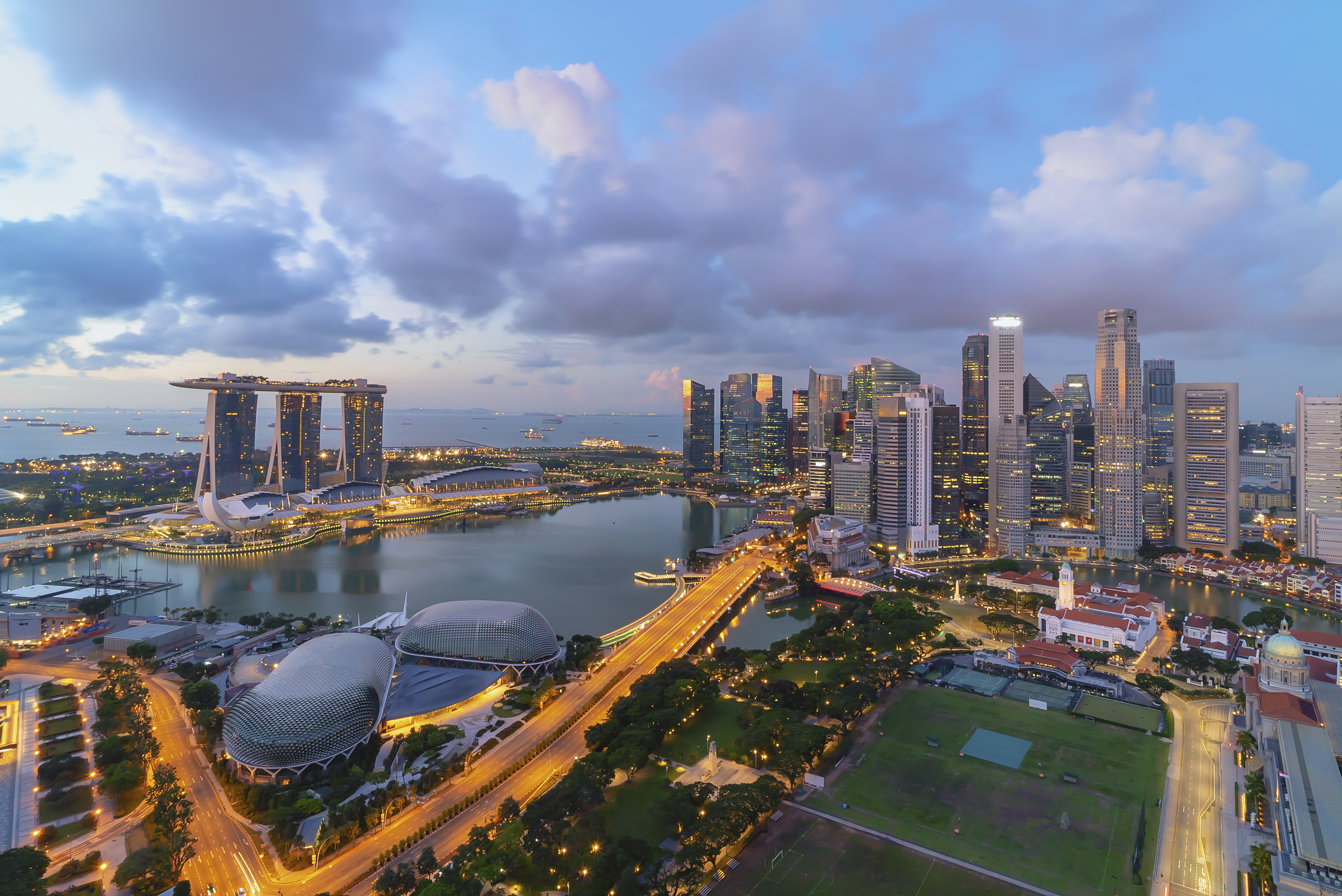 Singapore landmark city skyline, with iconic three tower Marina Bay Sands, during sunrise