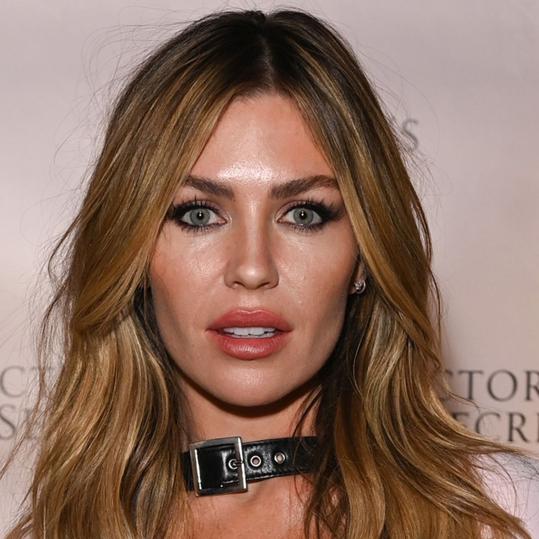 Abbey Clancy puts sky-high legs on full display in tiny denim shorts and daring boots