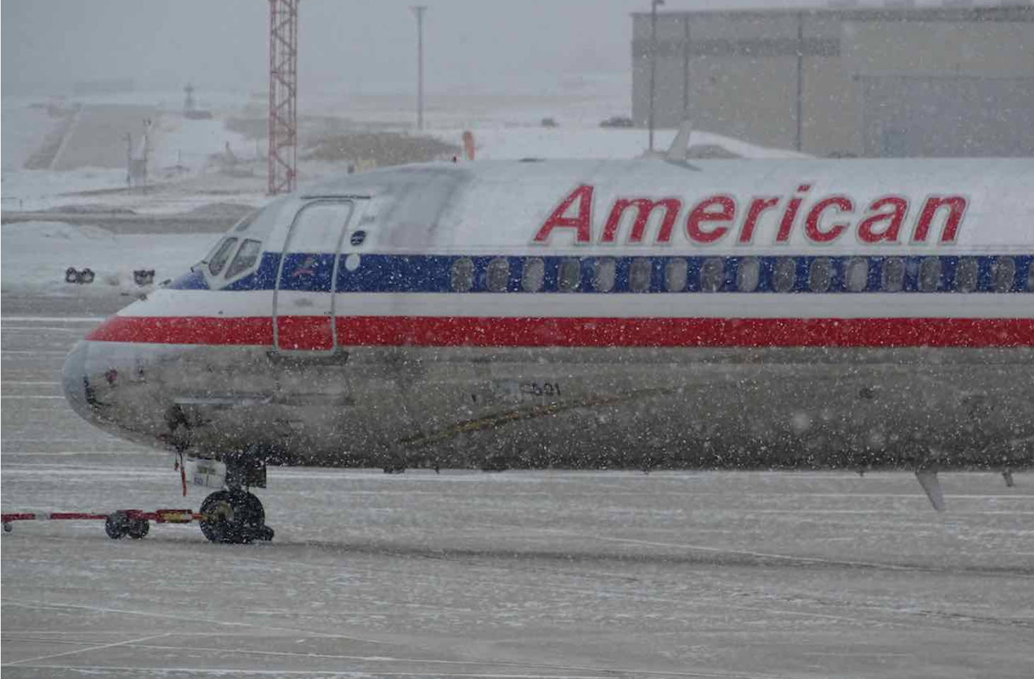 Plane towed to de-icing station during flight delay