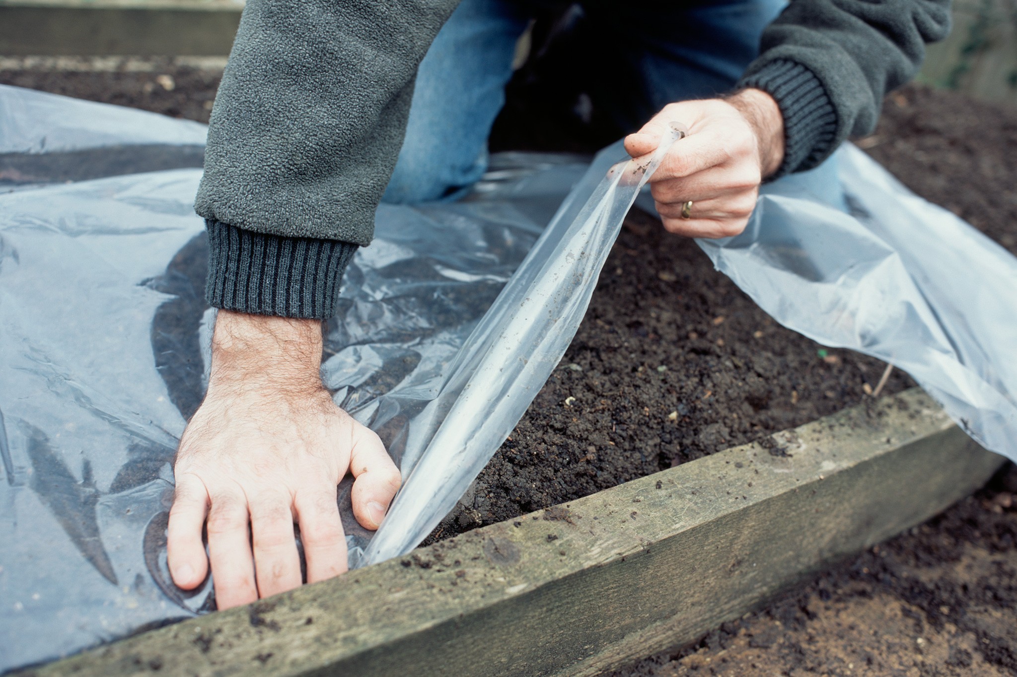 Covering a raised bed with polythene