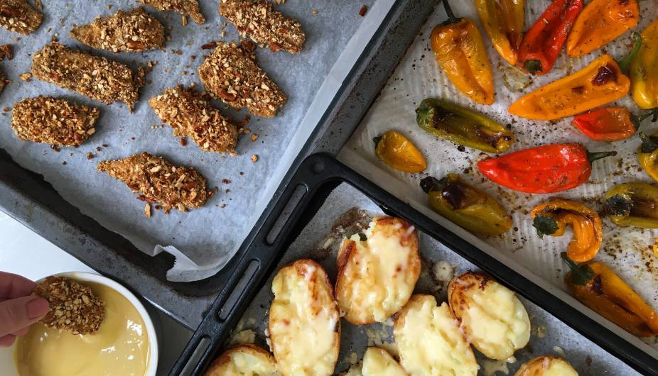 Baked Pretzel Crumb Fish Sticks with Cheesy Potatoes and Peppers