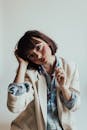 Beautiful Woman with Short Brown Hair Wearing a Beige Suit