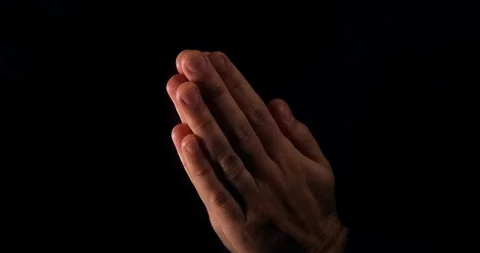 Male praying with hands clasped | Stock Video | Pond5