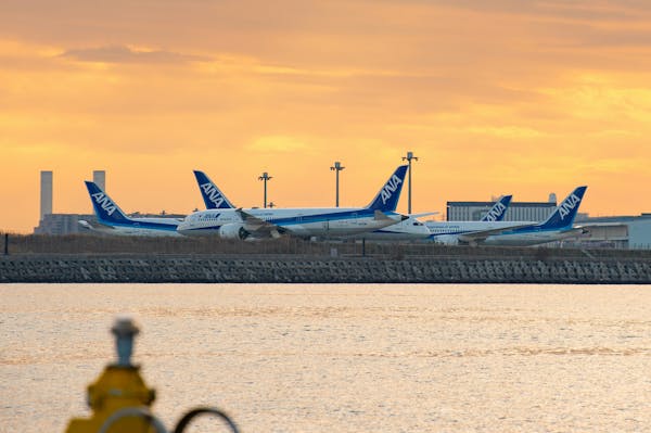 Parked planes at sunset at Haneday Airport in Tokyo