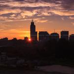 The sun peeks behind PNC Plaza