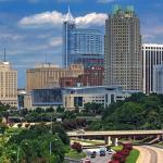 Tall tripod view of Raleigh with new Red Hat sign