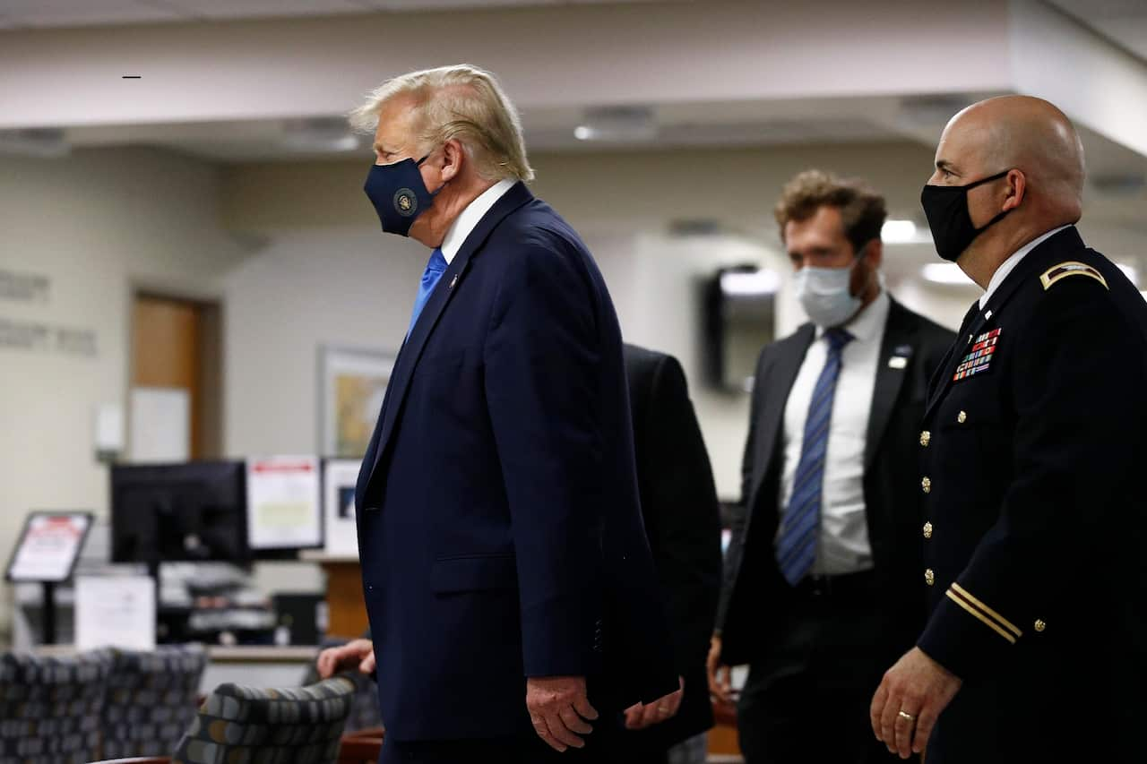 US President Donald Trump has up until now avoided wearing a mask in public even as the coronavirus pandemic spread.