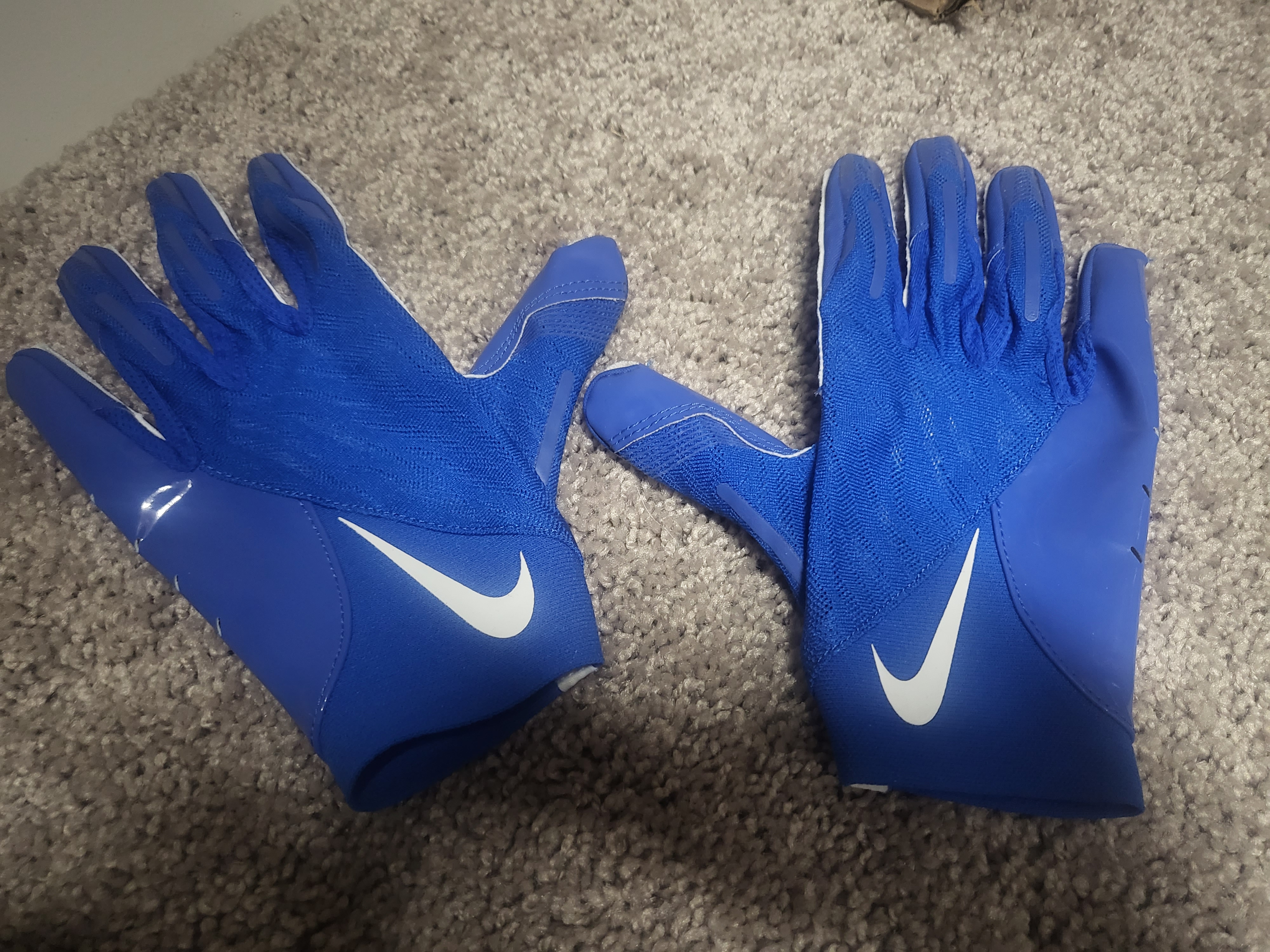 SMU game worn football gloves; team issued