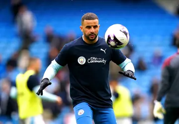 Kyle Walker warms up ahead of the Premier League match