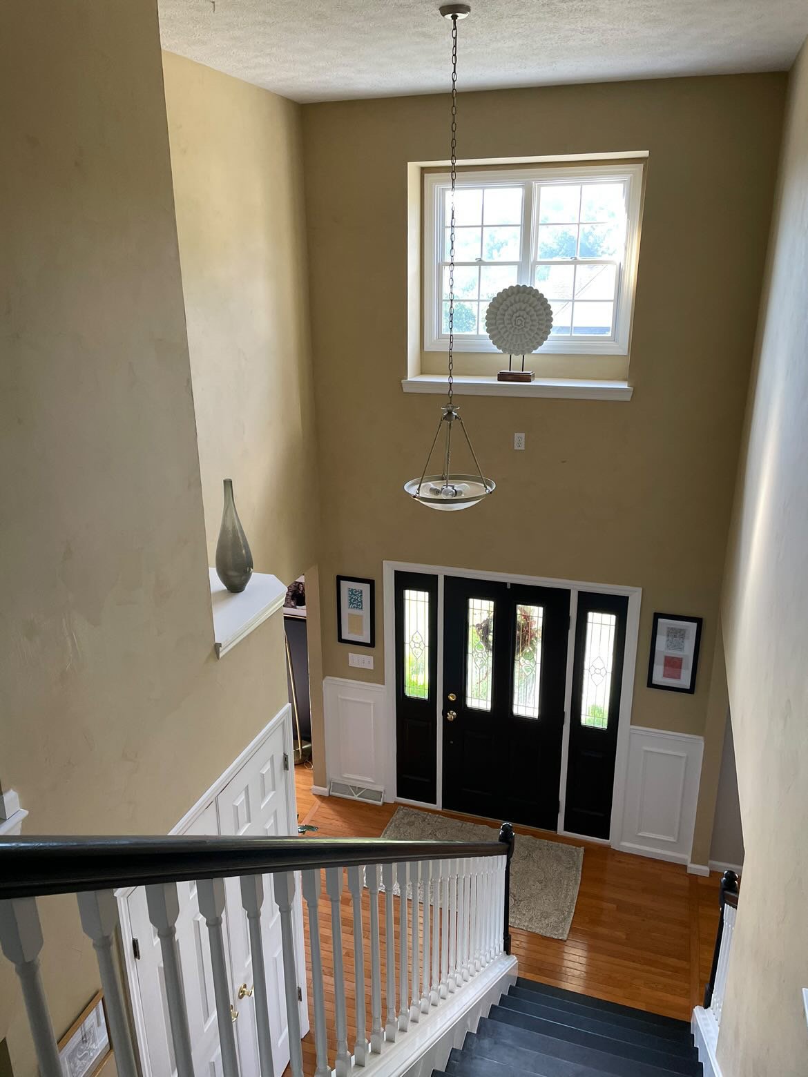 How To Decorate A Two Story Foyer With High Ledges And Window — Designed