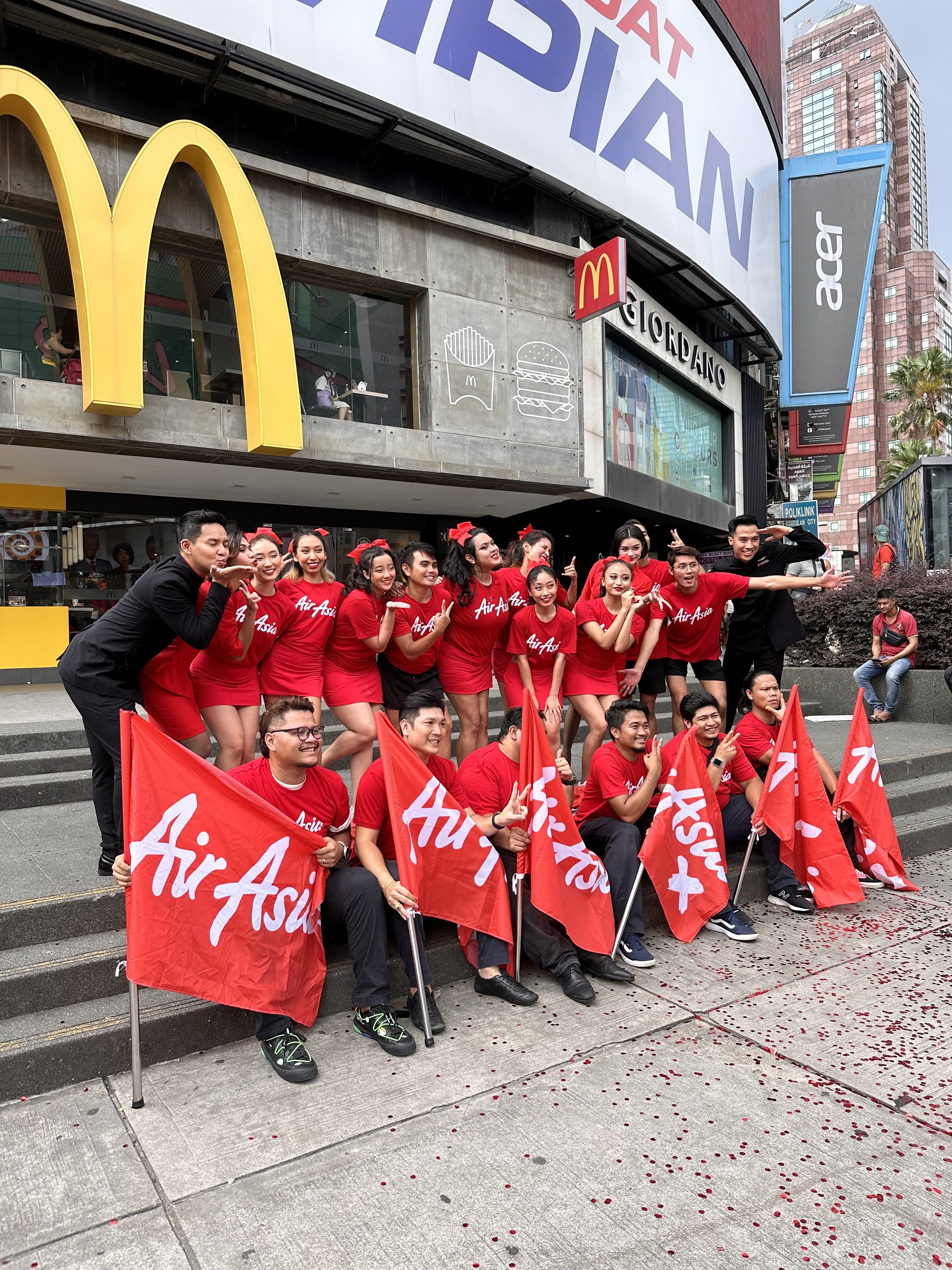   [Photo caption: AirAsia paints KL red!]  